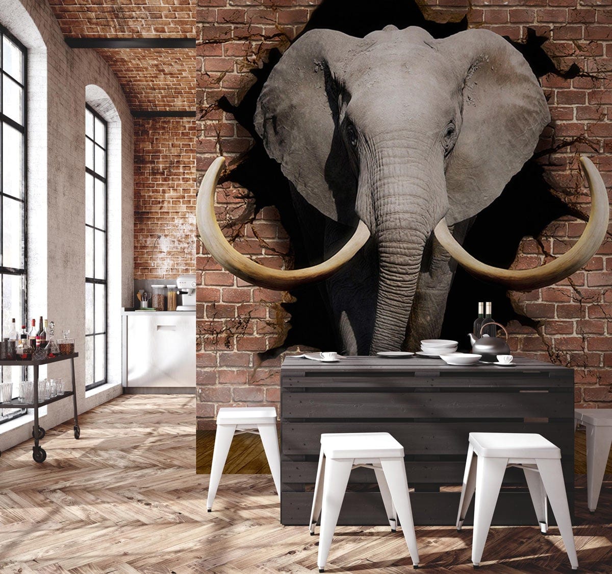 Elephant wall mural in rustic kitchen with brick wall, dark wood dining table, and white stools.