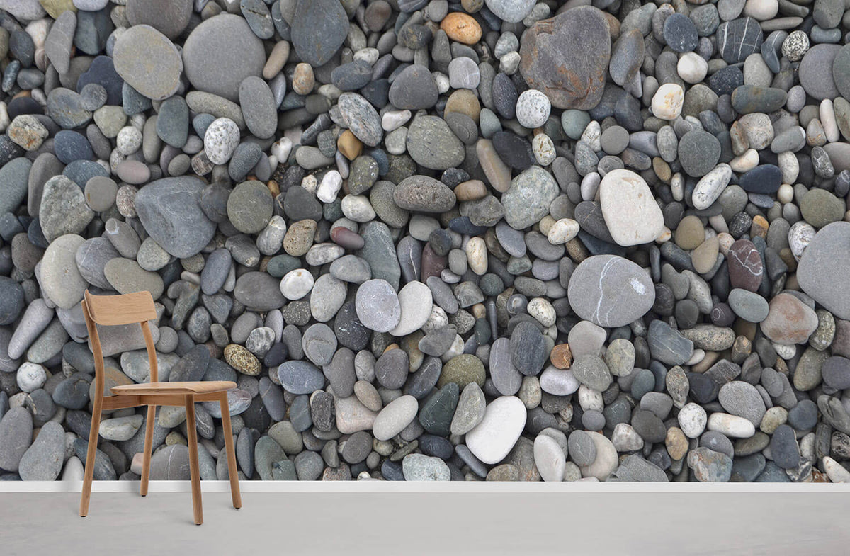 Natural Pebble Stones Grey Wallpaper, wooden chair, white skirting, neutral flooring in modern living room.