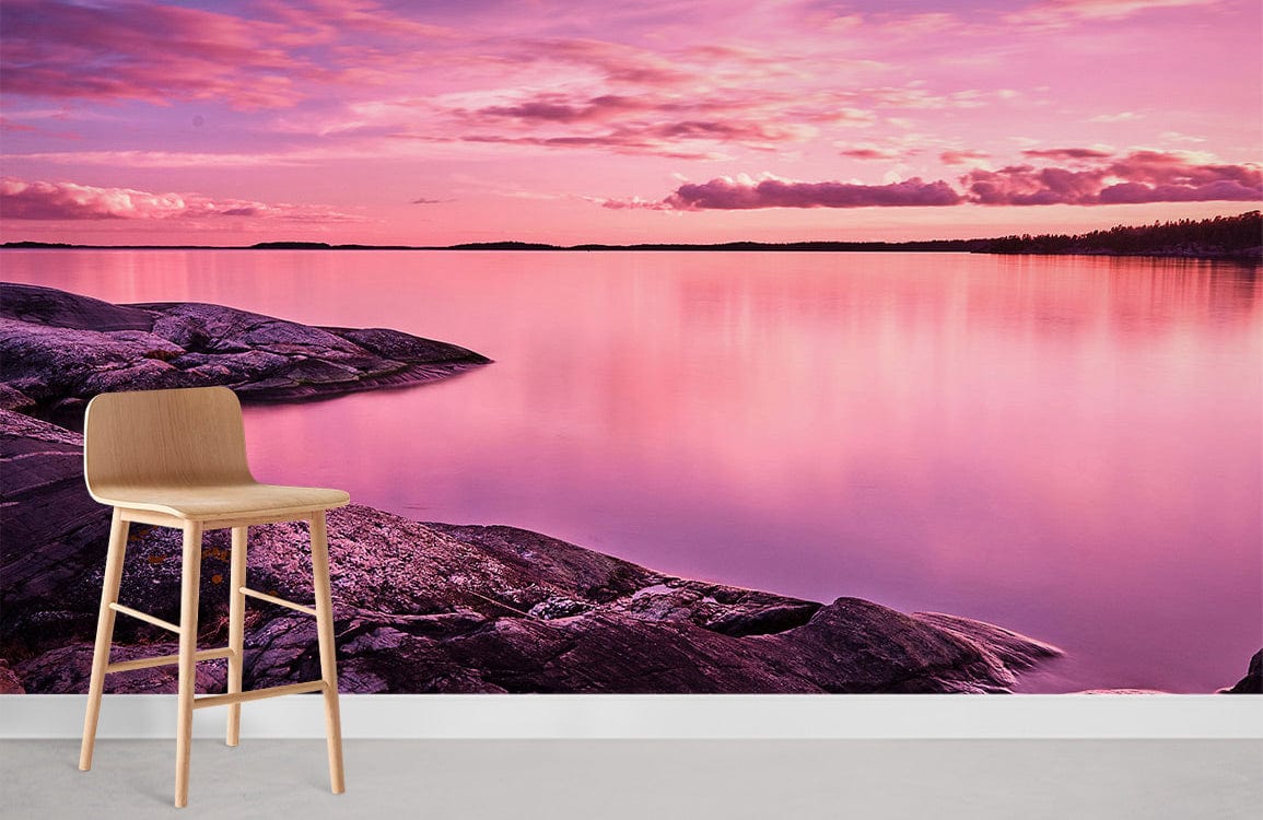 Serene Pink Sunset Lake mural wallpaper with modern stool, ideal for tranquil room Décor.