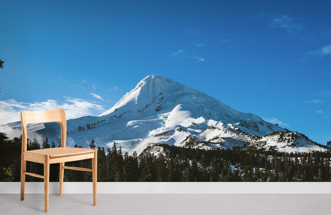Scenic Snowy Mountain Mural Wallpaper in living room with wooden chair and grey flooring, nature wall Décor.
