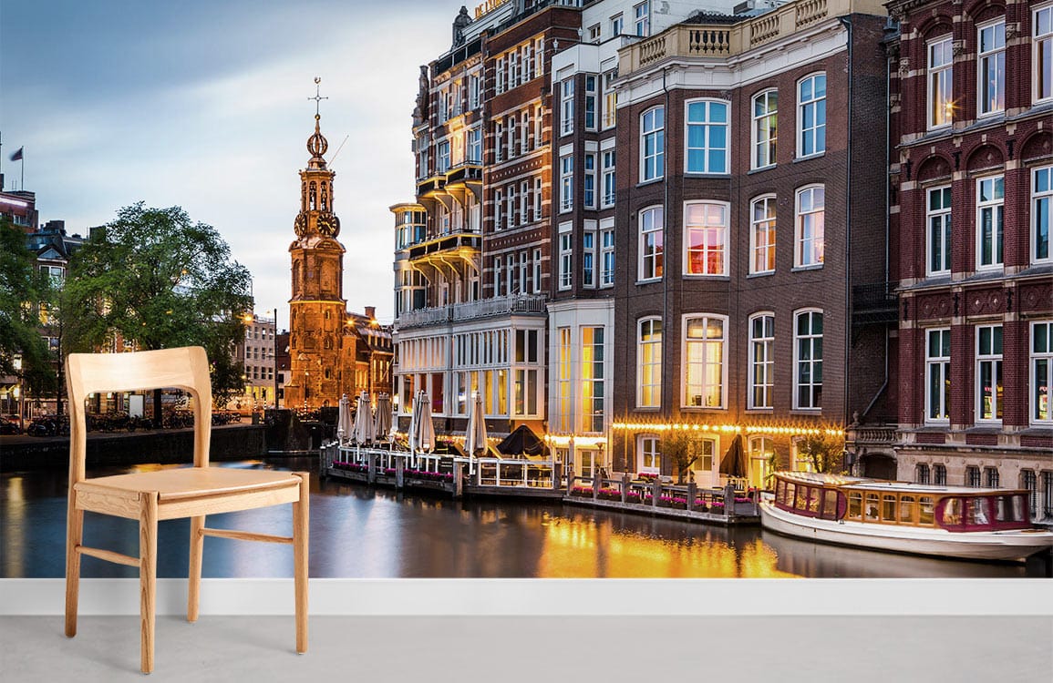 Amsterdam Canal Sunset Mural Wallpaper in living room with wooden chair on grey flooring.