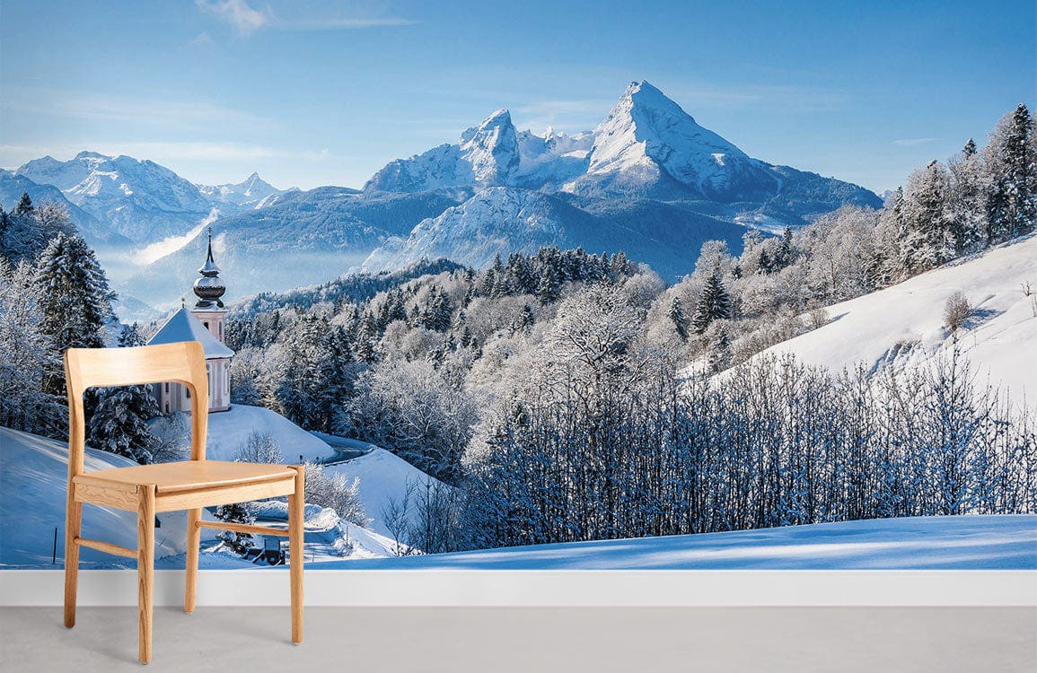 Majestic Winter Scene Mural Wallpaper, wooden chair, grey flooring, serene room, snowy mountains.