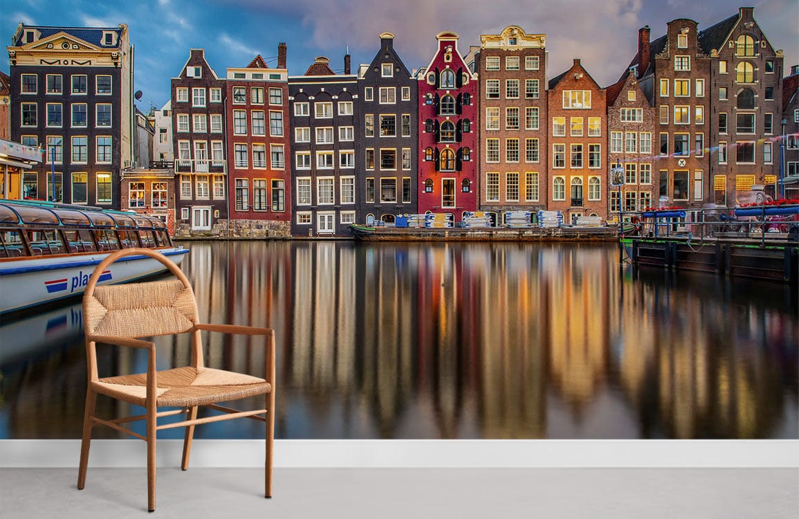 Colourful Amsterdam canal houses mural wallpaper, minimalist wooden chair, modern white skirting board, vibrant decor.