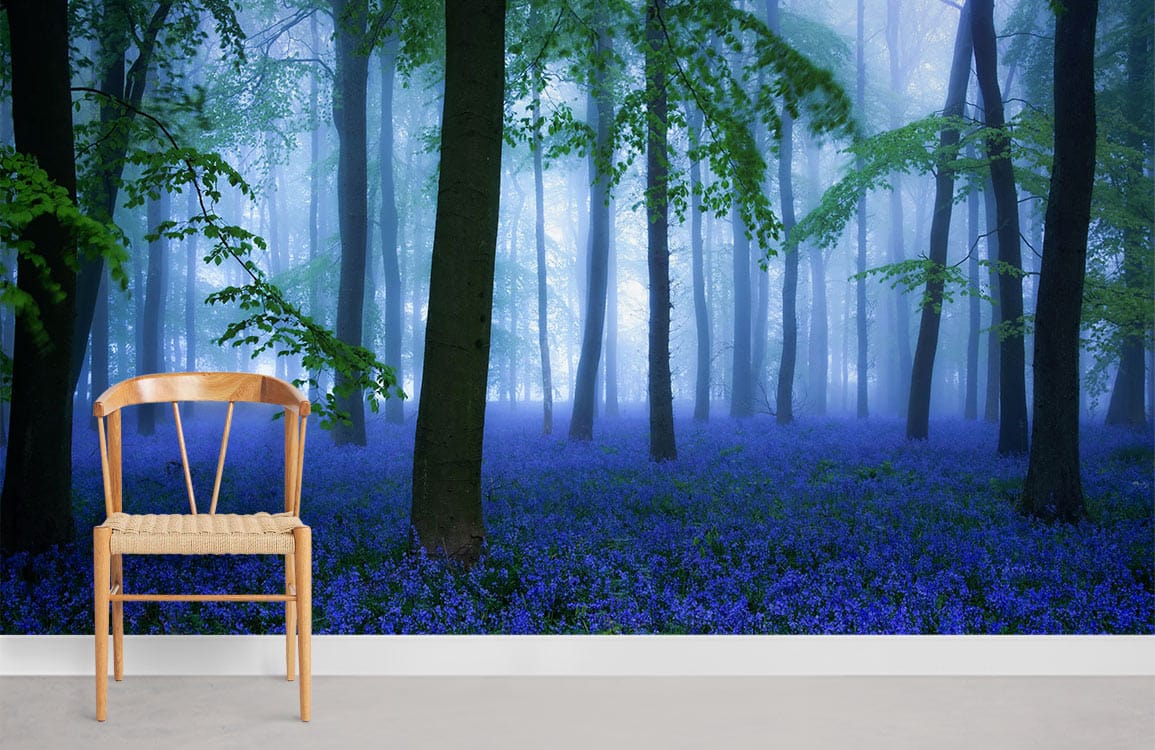 Chair with Enchanting Bluebell Woodland Mural Wallpaper, misty forest scene, and grey flooring in room.
