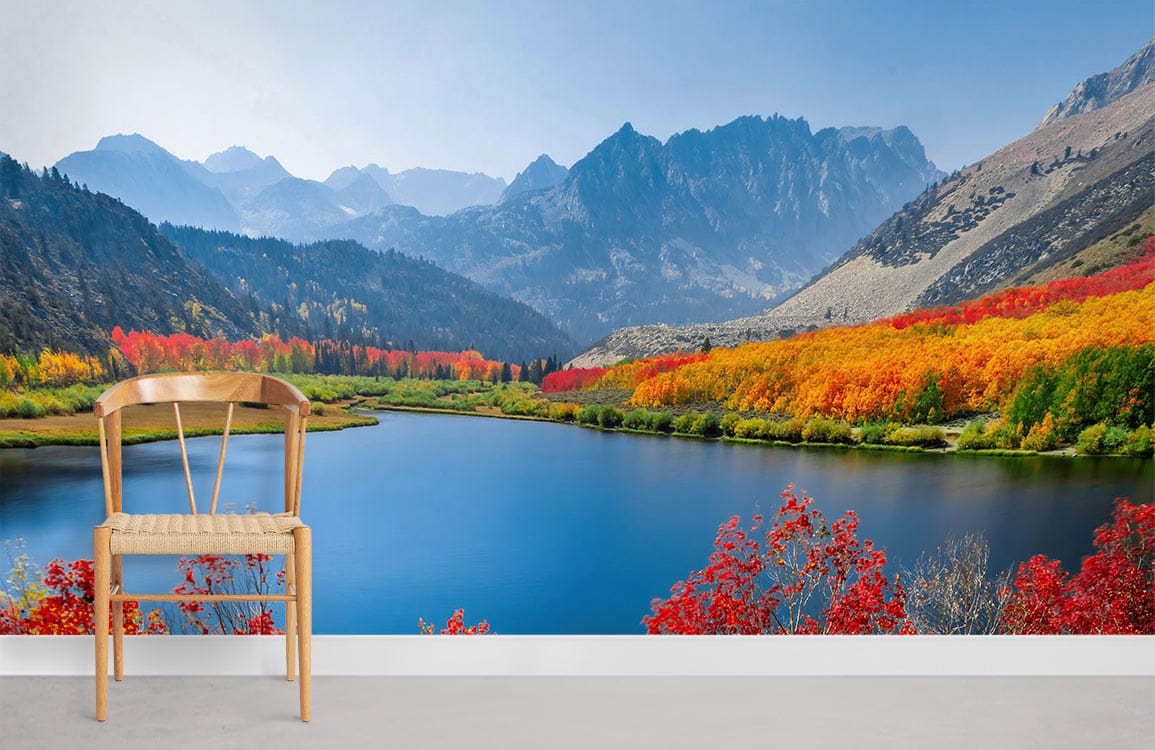 green mountains surround a quiet lake with beautiful trees around wall murals for home 