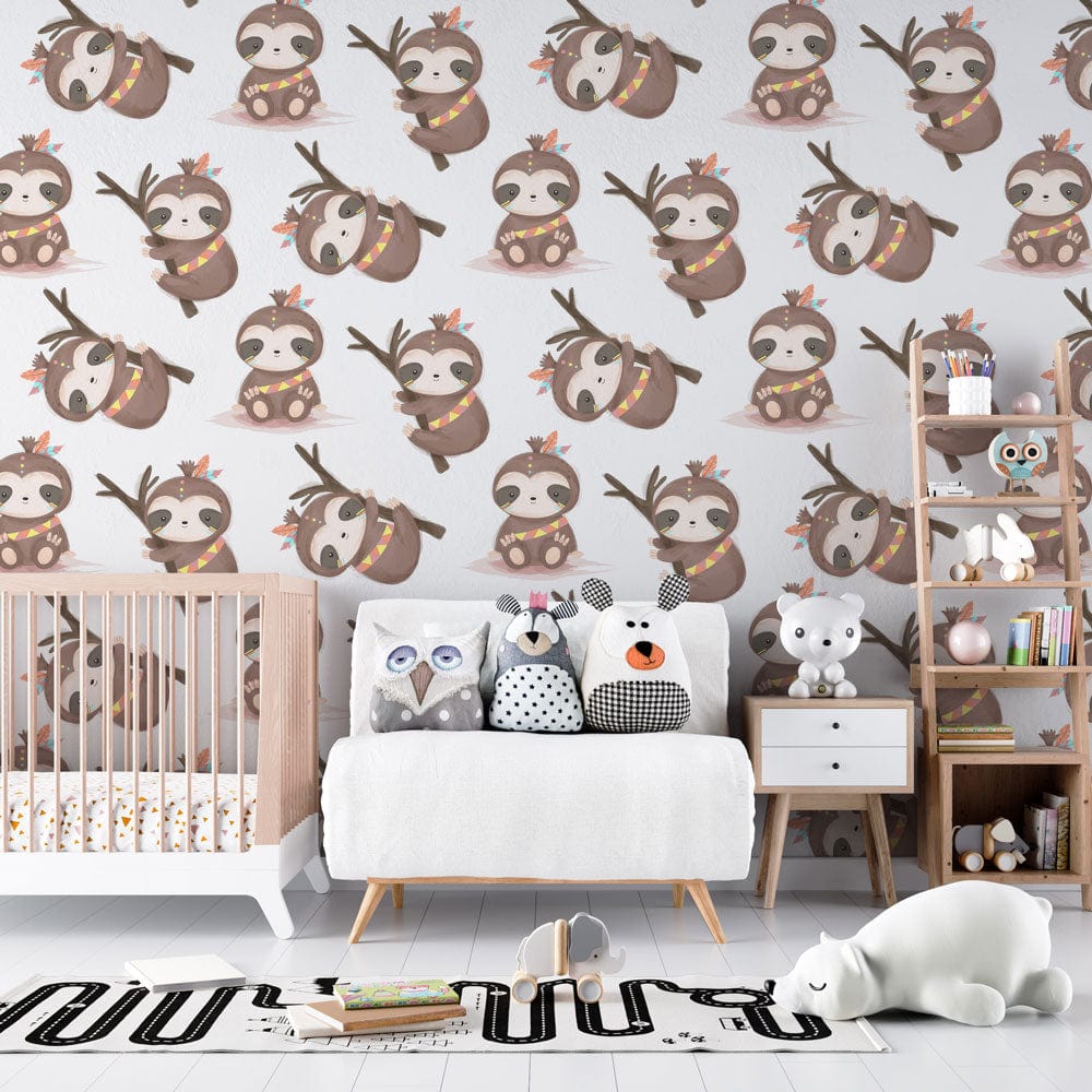 Cosy nursery with adorable sloth and reindeer wallpaper, white crib, sofa, wooden shelves, and toys.