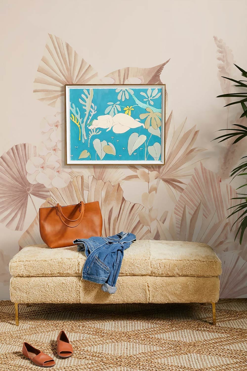 Luxurious room with Elegant Pastel Botanical Floral Wallpaper Mural, soft ottoman, framed art, and rug.