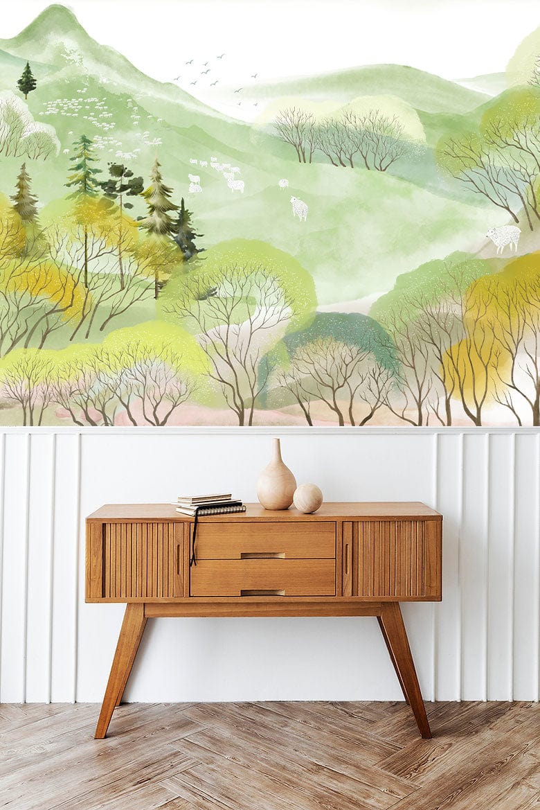 Serene Pastel Forest Landscape Mural Wallpaper with wooden cabinet, herringbone flooring, white wall panelling.