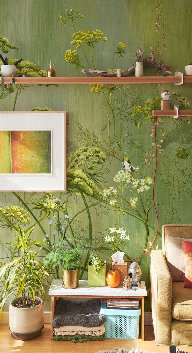 Botanical Garden Green Floral Mural Wallpaper, beige sofa, natural wood flooring, modern living room setting.
