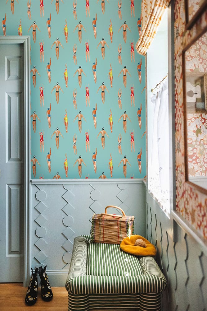 Retro Swimmers Aqua Blue Patterned Wallpaper; hallway setting with striped bench, stylish wainscoting.
