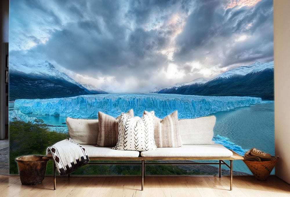 Spectacular Blue Glacier Mural Wallpaper with contemporary sofa, light wood flooring, and geometric cushions.