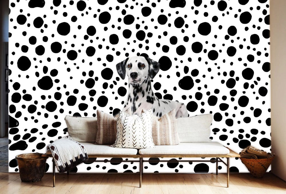 Dalmatian dot patterned wallpaper with sofa; classic black and white style; wooden flooring.