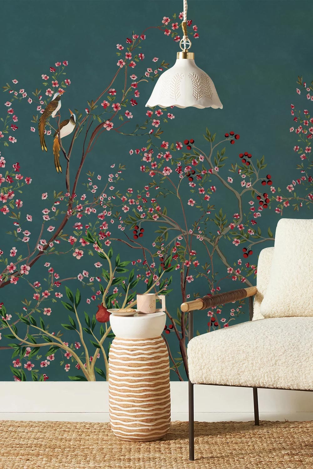 Elegant Teal Floral Bird Chinoiserie Mural Wallpaper with beige chair and woven rug in living room.