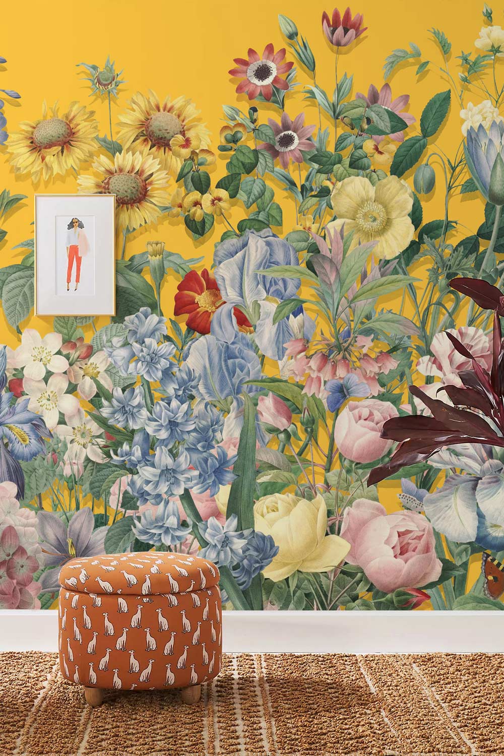 Vibrant Floral Symphony yellow botanical mural wallpaper; orange patterned stool; framed art; woven rug.
