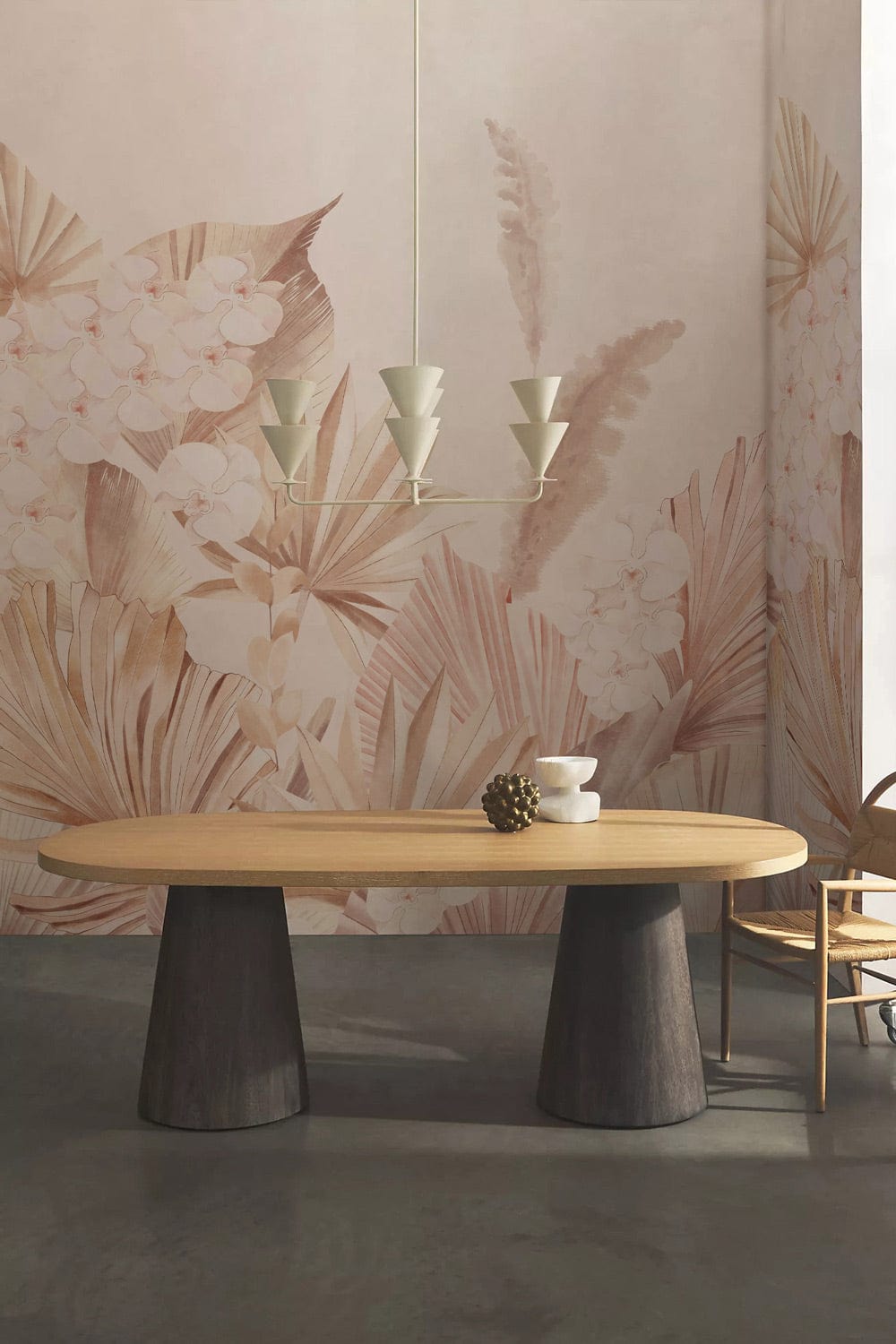 Elegant pastel botanical floral wallpaper in dining room with wooden table, unique chandelier, and chair.