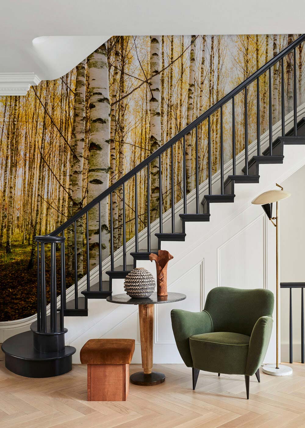 Golden Birch Forest Sunlit Autumn Mural Wallpaper, serene interiors, green chair, wooden staircase, lamp.