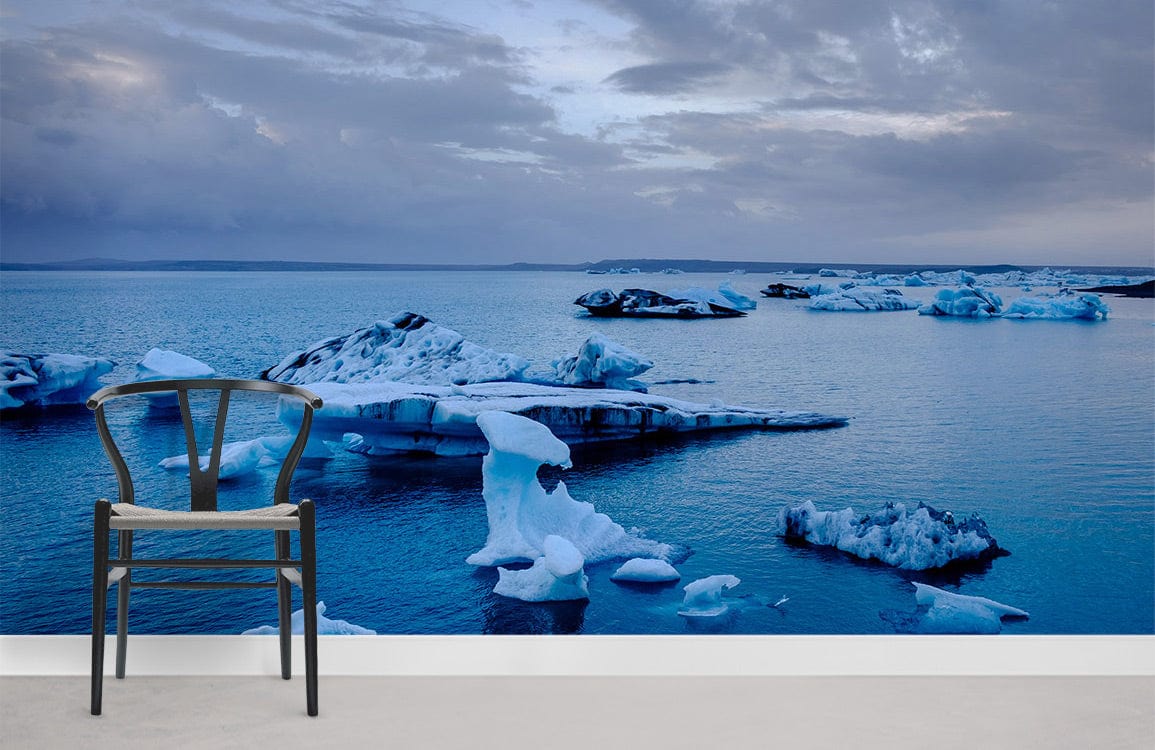 Chair with Arctic Iceberg Mural, blue serene ocean wallpaper, modern grey floor, scenic landscape theme.