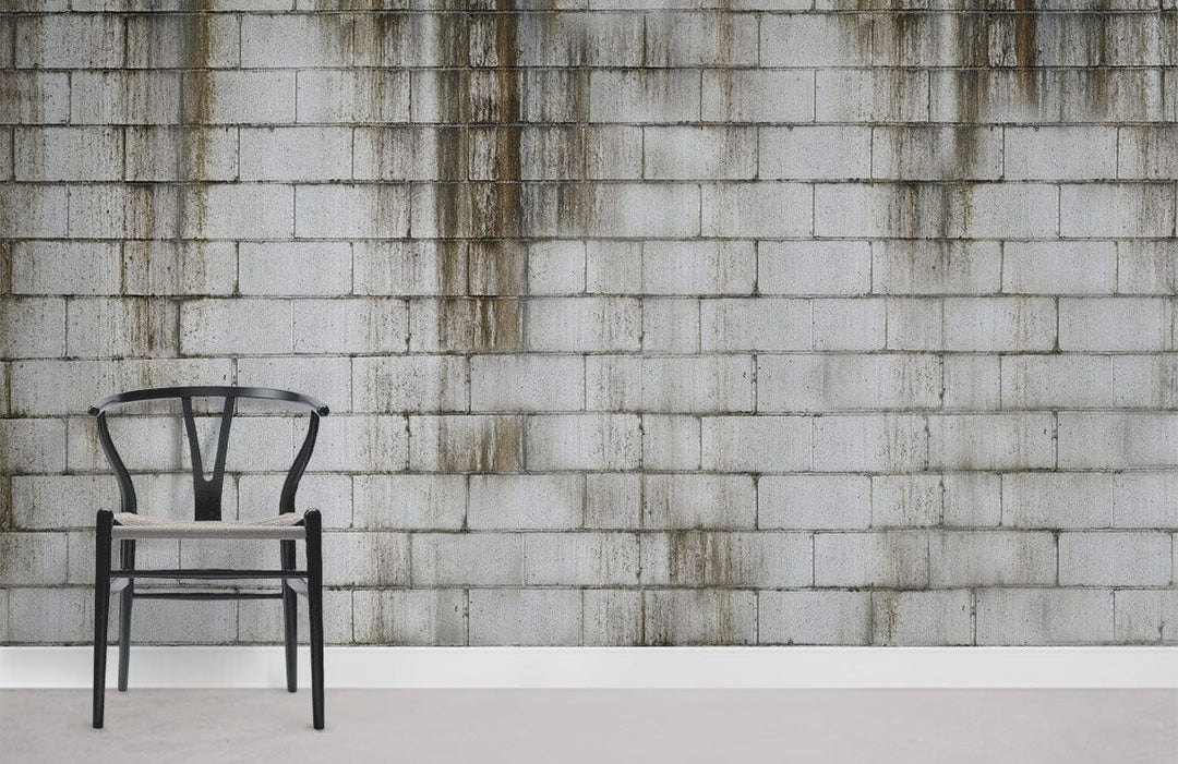 Industrial grey concrete brick wallpaper with black chair, urban loft decor, grey flooring.