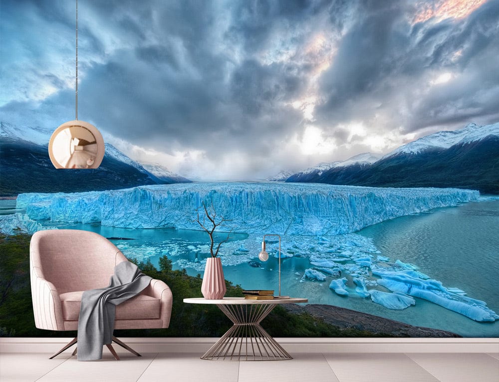 Spectacular Blue Glacier Mural: Living Room Wallpaper with Pink Chair, Modern Table, Pendant Light.