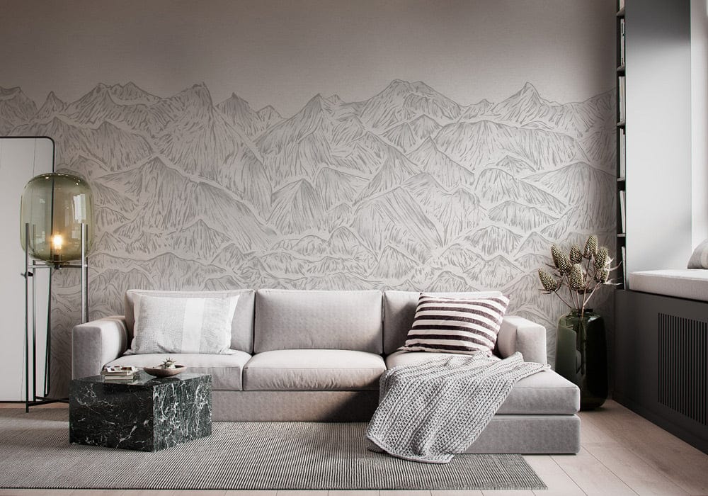 Grey Mountain Sketch Wallpaper Mural in living room with grey sofa, marble table, wooden flooring.