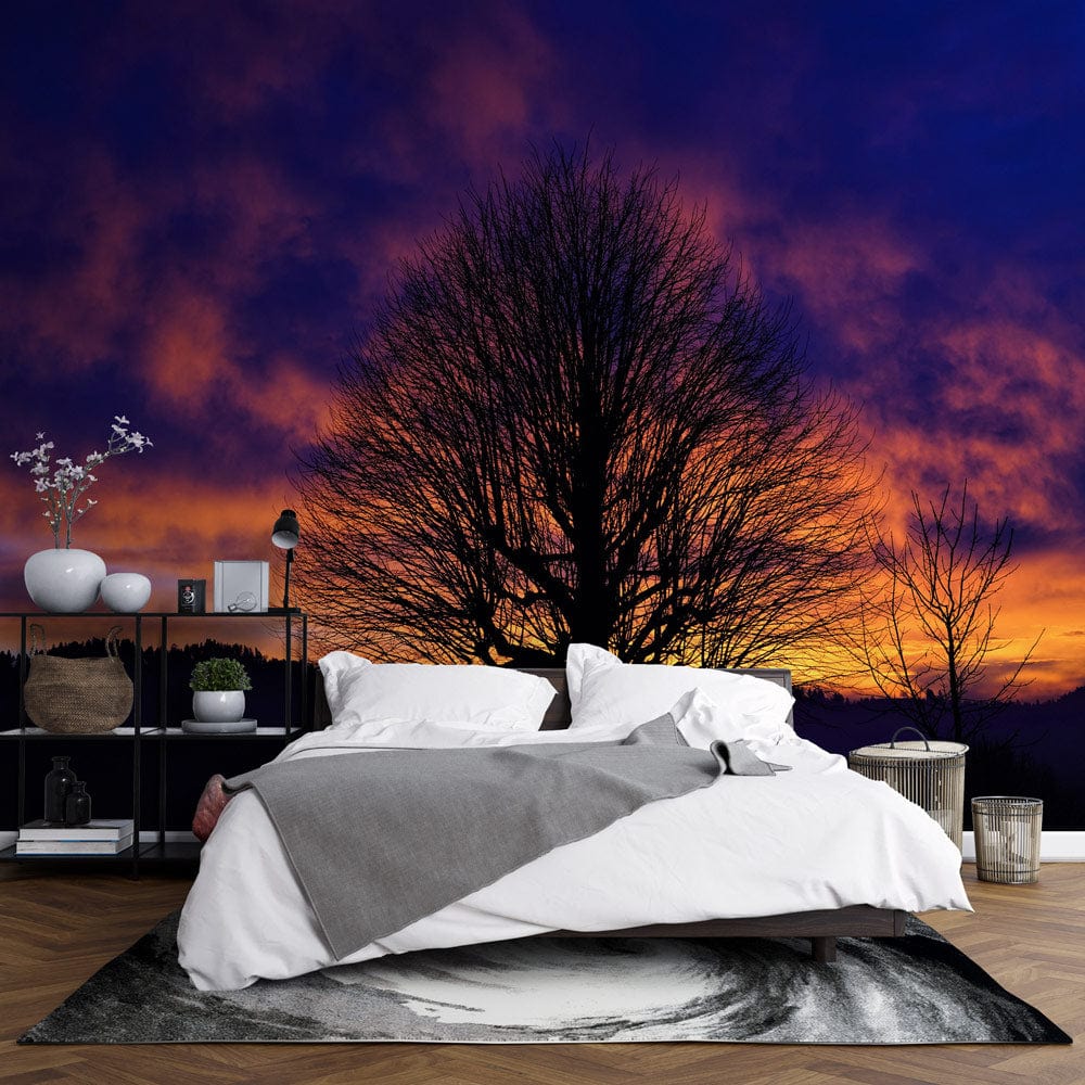 Vivid Twilight Wallpaper in bedroom with modern grey sofa, dark wood flooring, elegant wall decor.