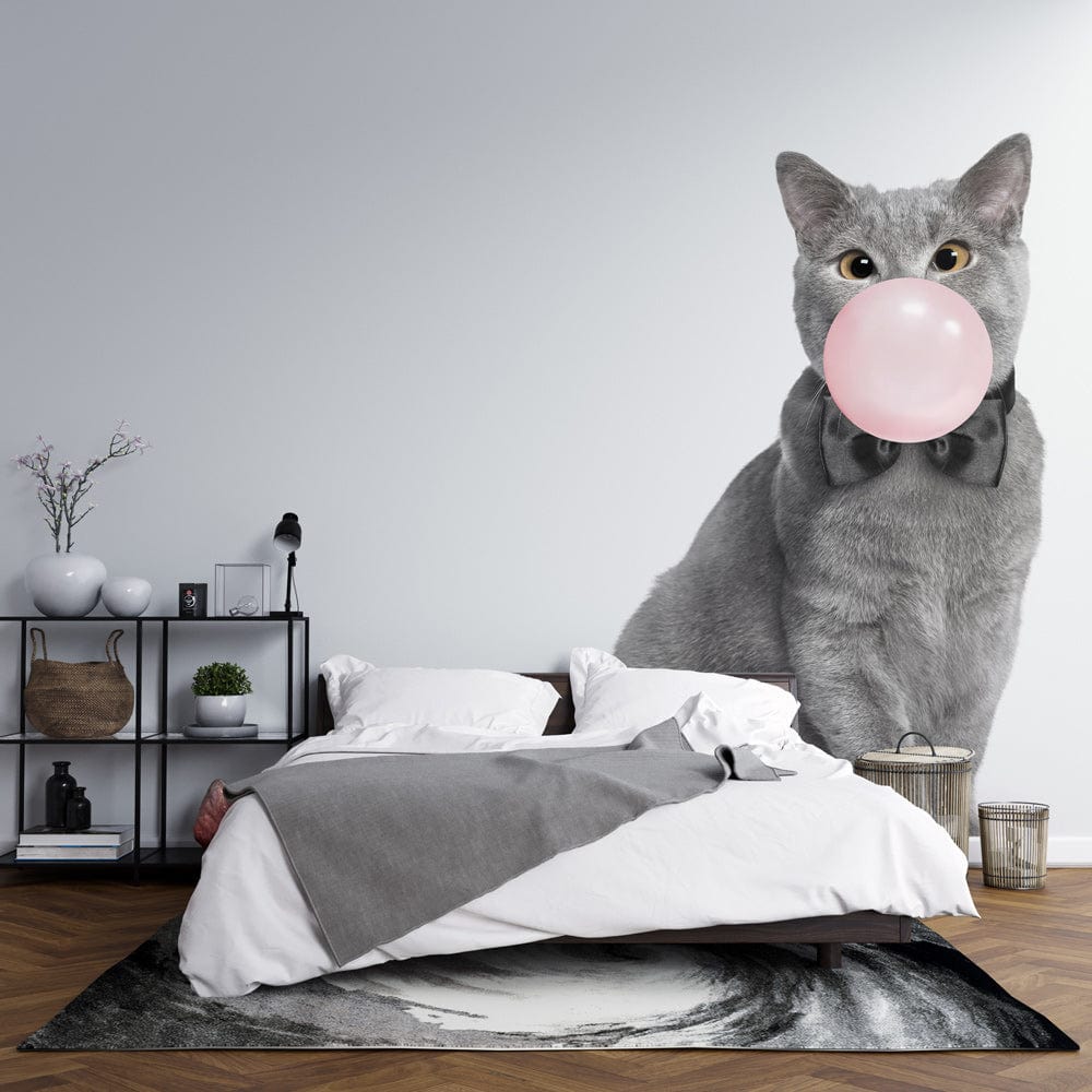 Chic Grey Cat Bubblegum Mural Wallpaper in bedroom with grey bedding and modern shelving.