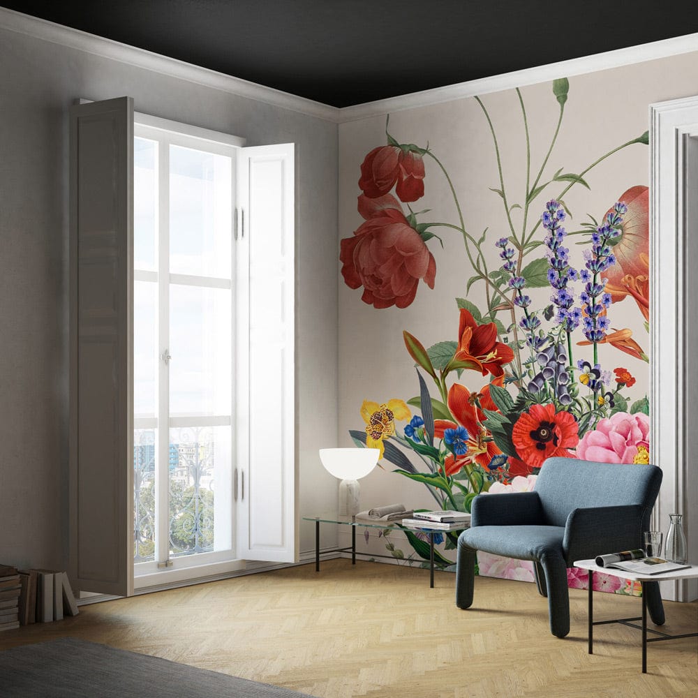 Vintage Floral Garden Mural Wallpaper in elegant living room with blue sofa and wood flooring.