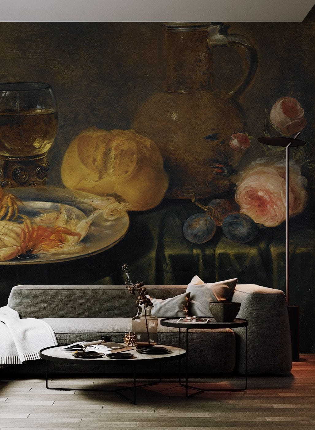 Vintage Still Life Mural Wallpaper, earthy tones, grey sofa, wooden flooring, cosy living room setting.