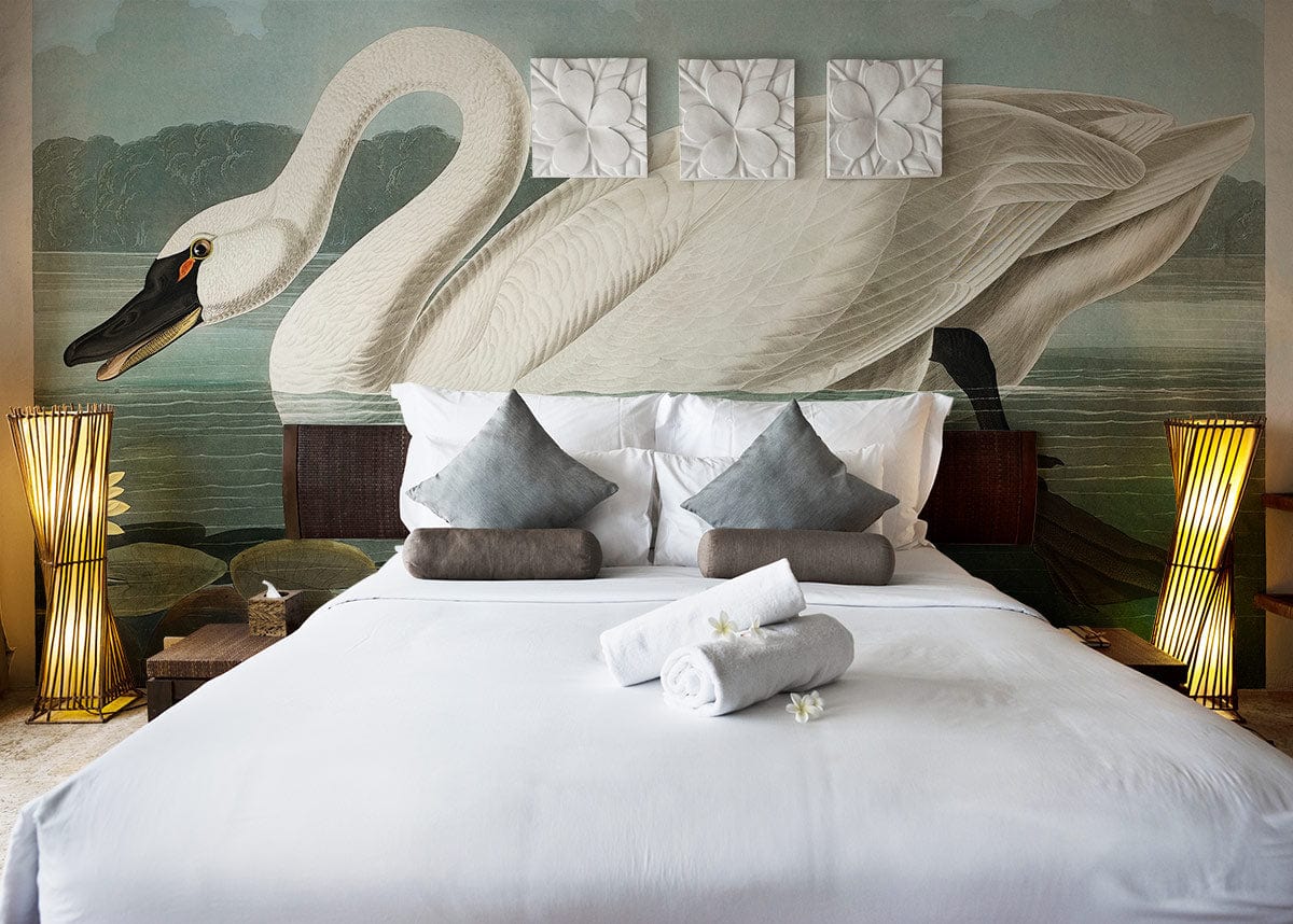 Elegant swan mural wallpaper in bedroom with white bedding, grey cushions, soft lighting, and vintage decor.