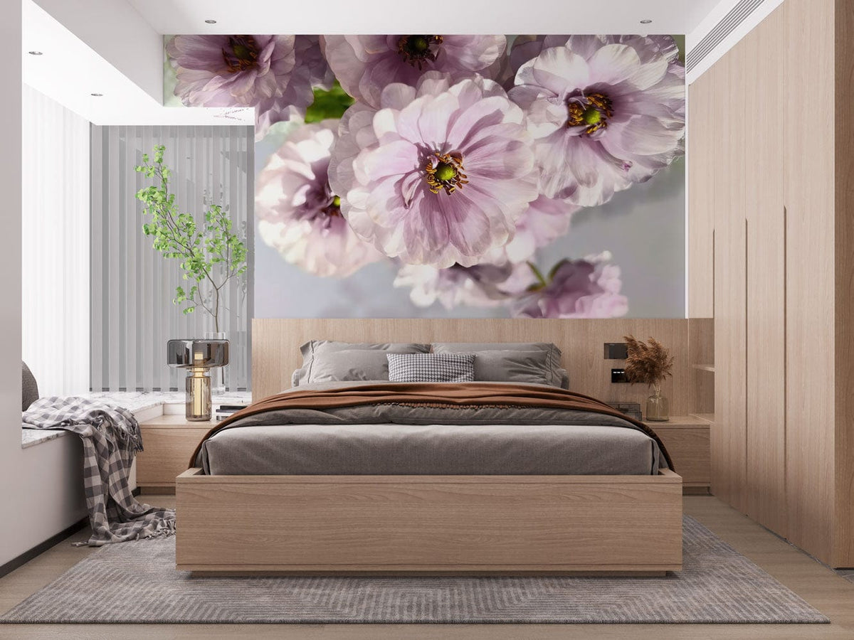 Blossoming Lavender Wallpaper in bedroom with grey bedding, light wood furniture and elegant decor elements.