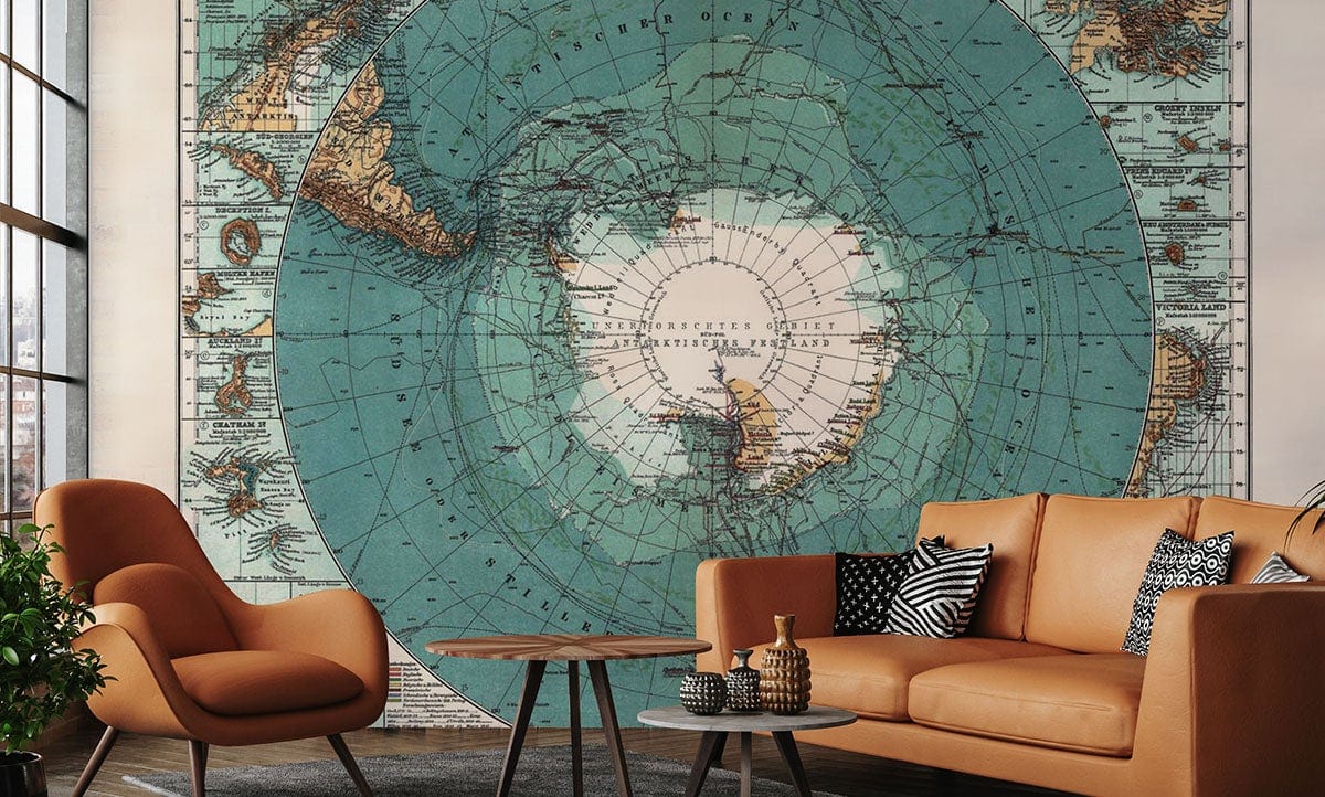 Vintage World Map Aqua Blue Mural Wallpaper; stylish living room with tan leather sofa, armchair, tables.