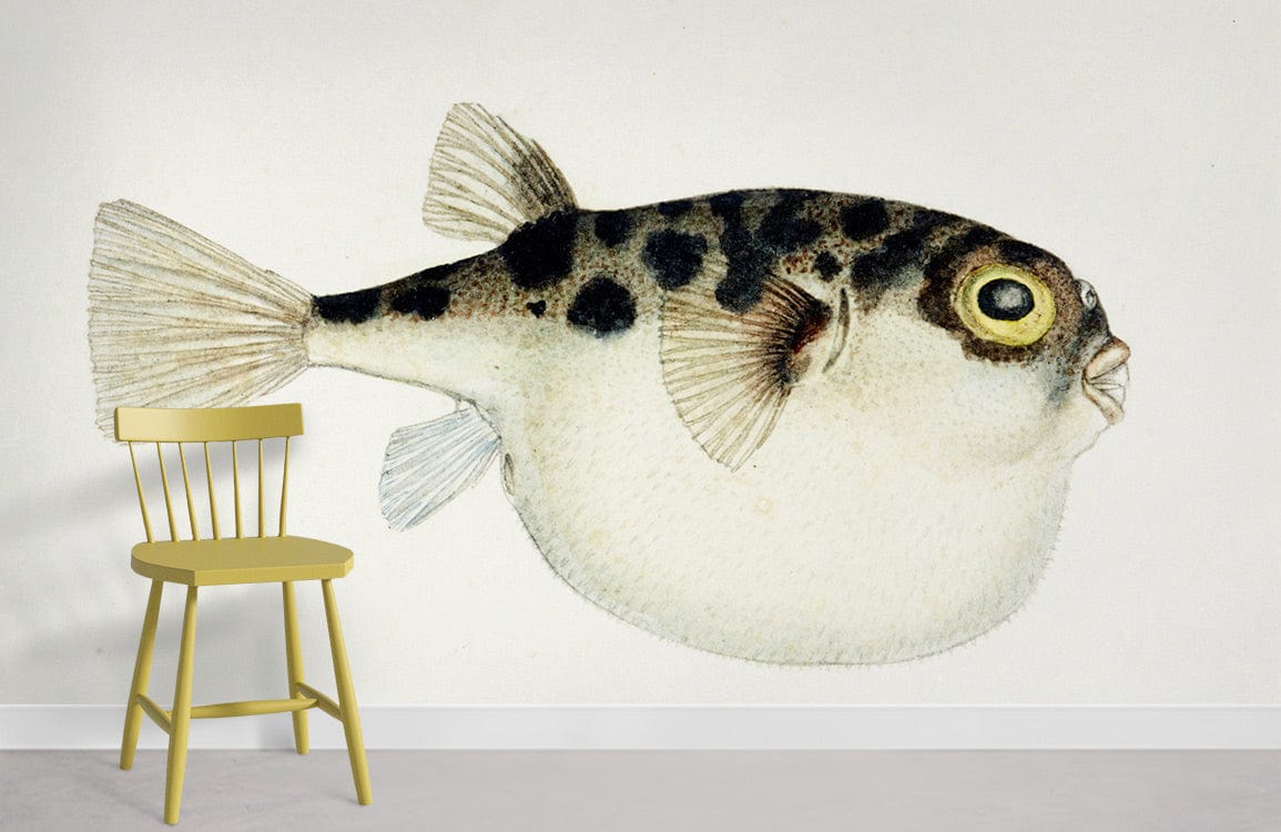 Vintage style pufferfish illustration wallpaper, coastal decor, featuring yellow chair, white wall, concrete floor.