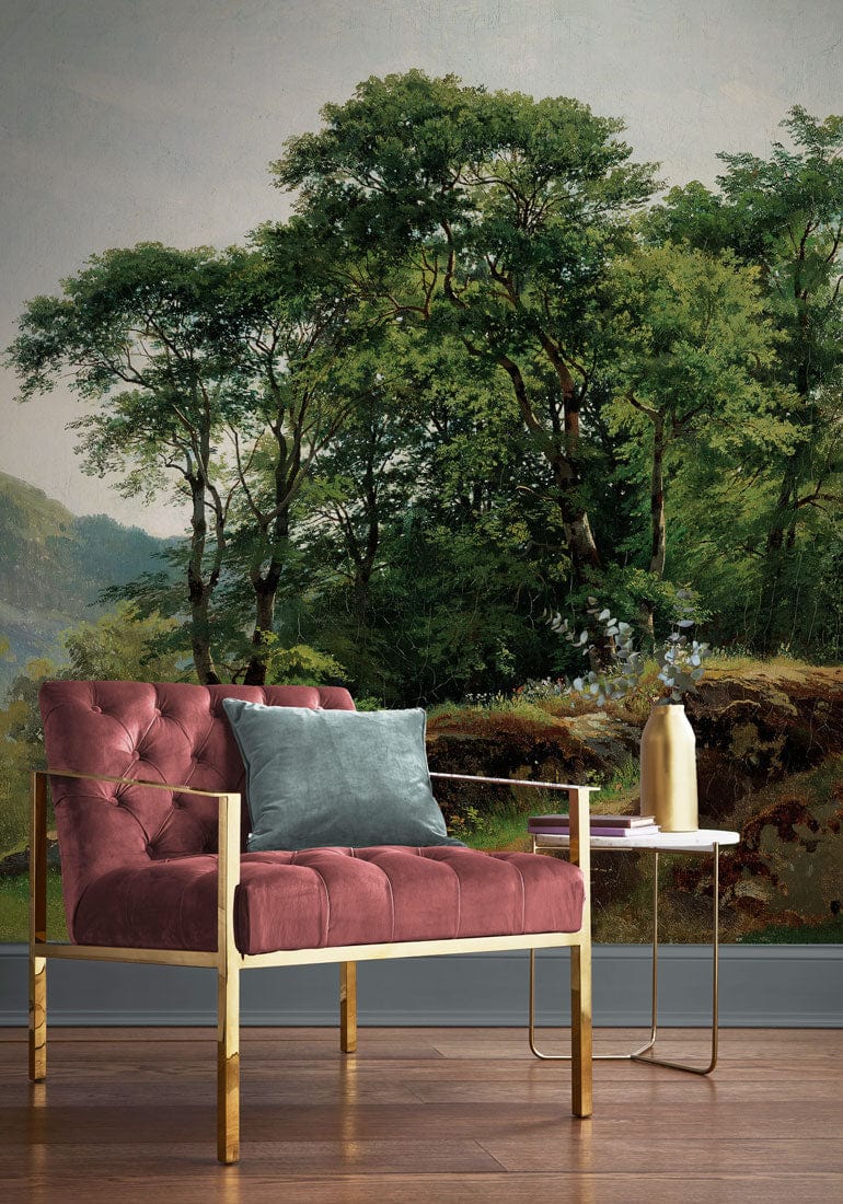 Tranquil Green Forest Landscape Mural Wallpaper, red armchair, wooden flooring, nature-inspired living room decor.