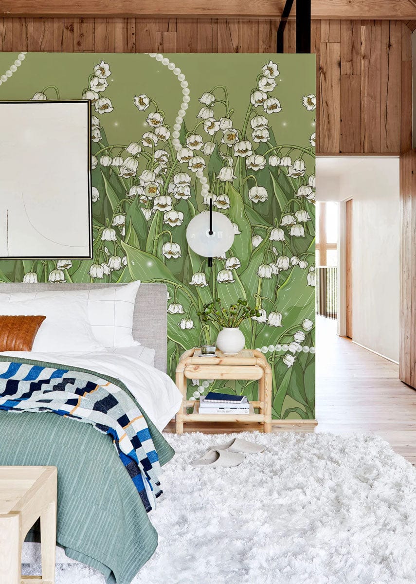 Elegant green Lily of the Valley wallpaper in bedroom with wooden floor, white rug, and modern decor.