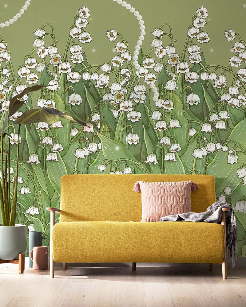 Elegant floral wallpaper mural with green lily print, featuring yellow sofa and light wood flooring.