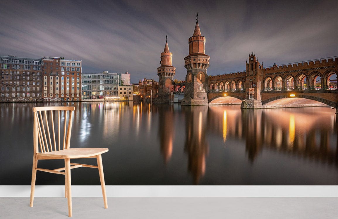 Majestic Berlin cityscape mural wallpaper with bridge, light wood chair, modern grey flooring in lounge.