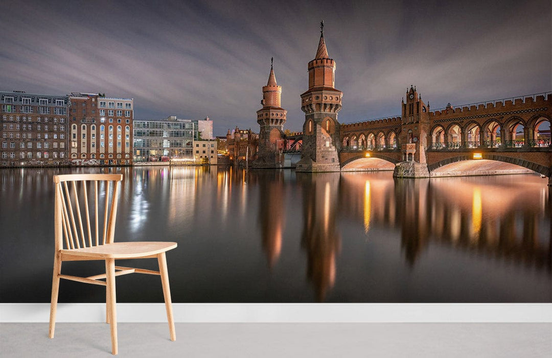 Majestic Berlin cityscape mural wallpaper with bridge, light wood chair, modern grey flooring in lounge.