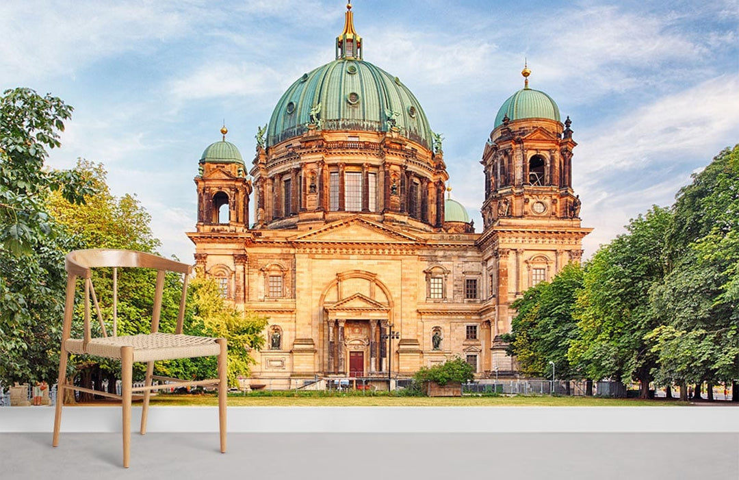 Historic European Cathedral mural wallpaper; earthy tones, light wood chair, bright setting, serene decor.