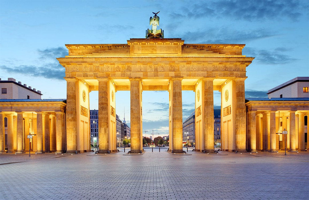 Illuminated Brandenburg Gate Mural Wallpaper in Golden Sunset Tones Elegance