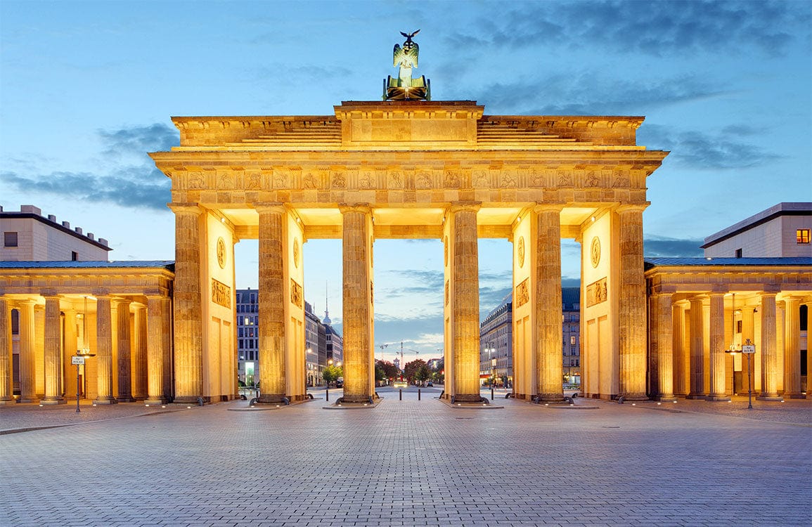 Illuminated Brandenburg Gate Mural Wallpaper in Golden Sunset Tones Elegance