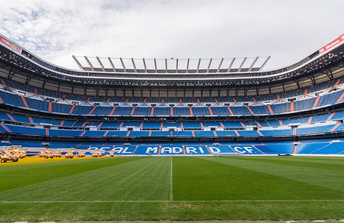 Real Madrid Stadium Mural Wallpaper: Iconic Football Arena in Vibrant Blue
