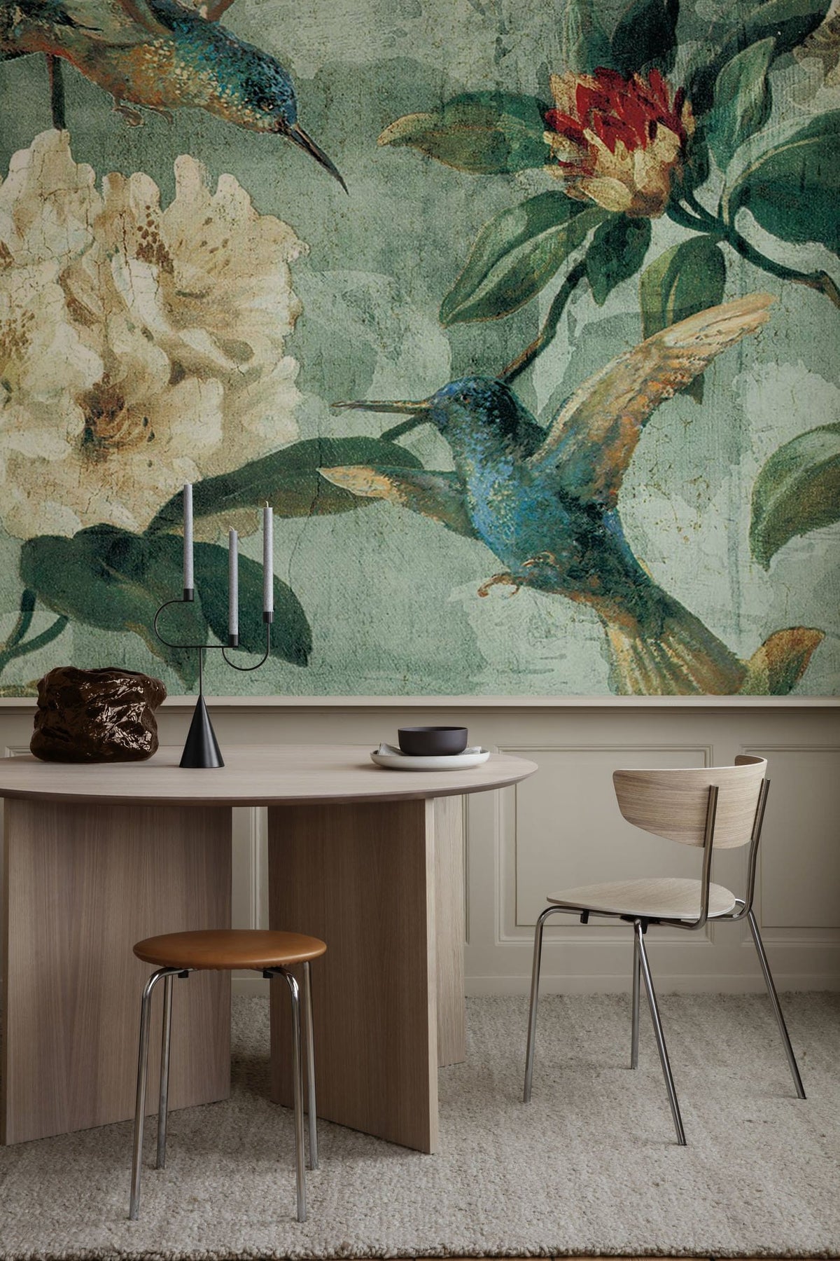 Vintage teal floral hummingbird mural wallpaper with botanical art; modern dining room, light wood table.