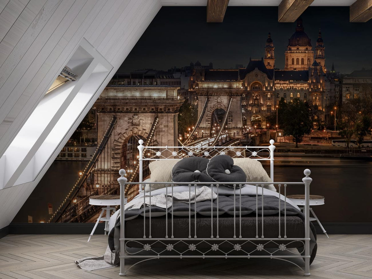 Attic bedroom with bridge mural wallpaper, metal bed, grey bedding, chevron flooring, exposed beams.