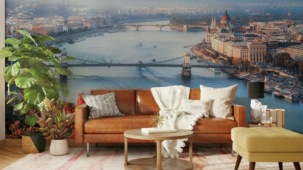 Panoramic Budapest River mural with leather sofa, wooden flooring, modern living room, autumn palette.