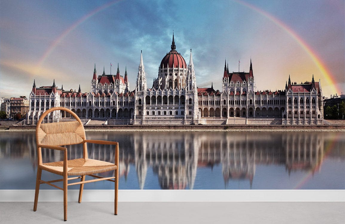Majestic Hungarian Parliament mural wallpaper, featuring a rainbow reflection with a wooden chair.