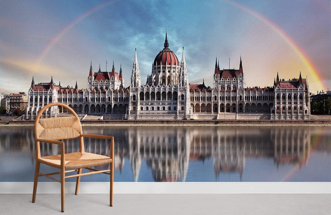 Majestic Hungarian Parliament mural wallpaper, featuring a rainbow reflection with a wooden chair.