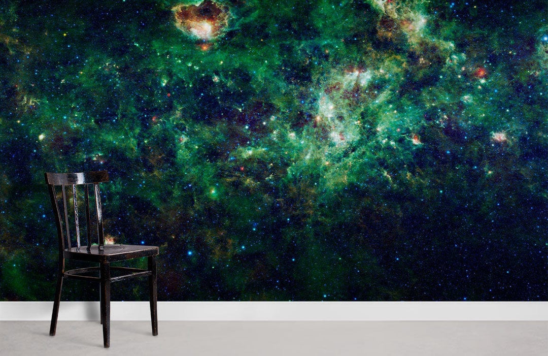 Deep Green Cosmic Galaxy Mural Wallpaper in room with black chair and simple grey floor.