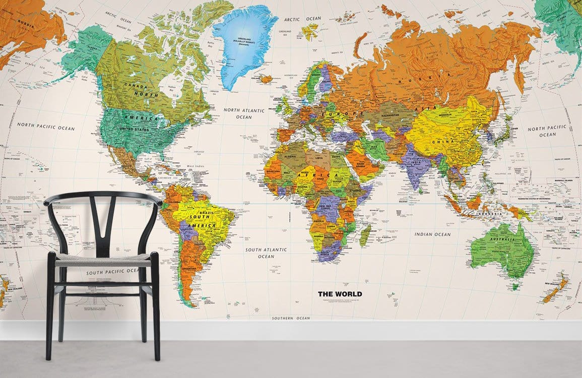 Colourful World Map Mural Wallpaper with chair, white wall, and light grey flooring in living room.