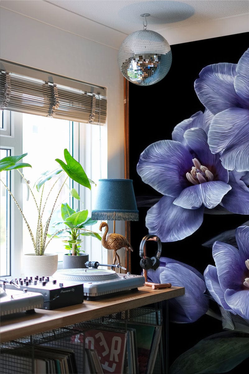 Vintage botanical mural wallpaper in home office with lilac blooms, black background, and musical equipment.