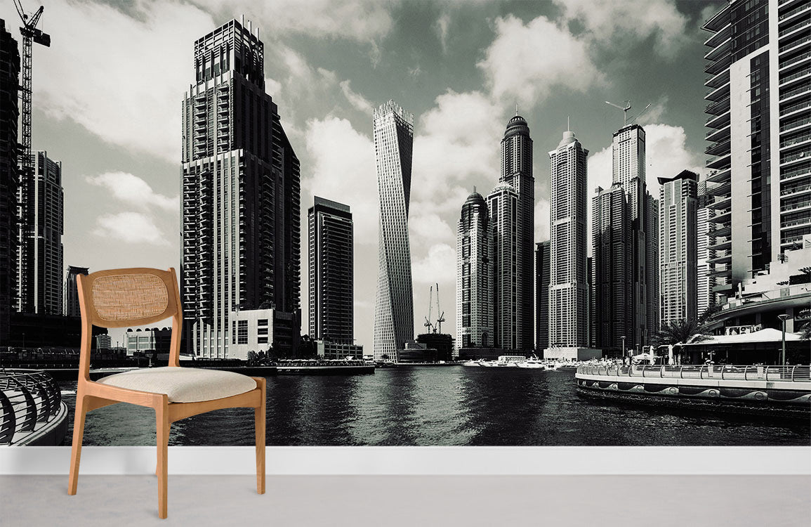 Monochrome cityscape wallpaper with chair, modern urban architecture decor, grey floor, white walls.